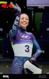 britains-tabitha-stoecker-waves-as-she-arrives-at-the-finish-during-a-womens-skeleton-run-at-t...jpg